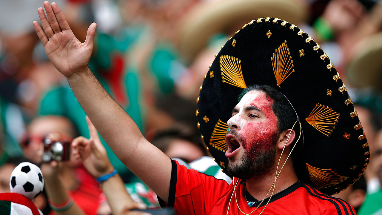 A Mexican fan chants before the group A World Cup soccer match between Brazil and Mexico.