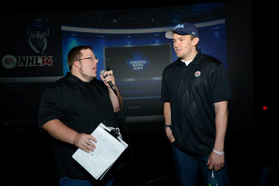 J.V.R. and I talking in front of the crow at the NHL 14 tournament.