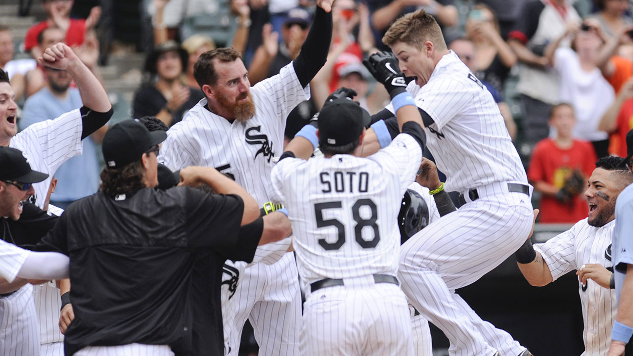 Chicago White Sox's Gordon Beckham, second from right, celebrates with teammates Adam LaRoche, fourth from right, and catcher Geovany Soto (58) after hitting a walkoff home run to defeat the Texas Rangers 3-2 in the eleventh inning on Sunday, June 21, 2015. (Matt Marton/AP)