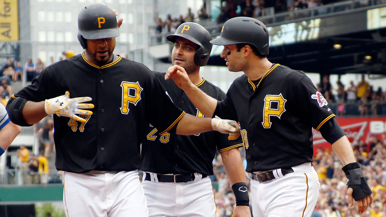 Pittsburgh Pirates starting pitcher Francisco Liriano (47) is greeted by teammates Neil Walker (18) and Francisco Cervelli (29) after driving them in with a three-run home run. (Keith Srakocic/AP)