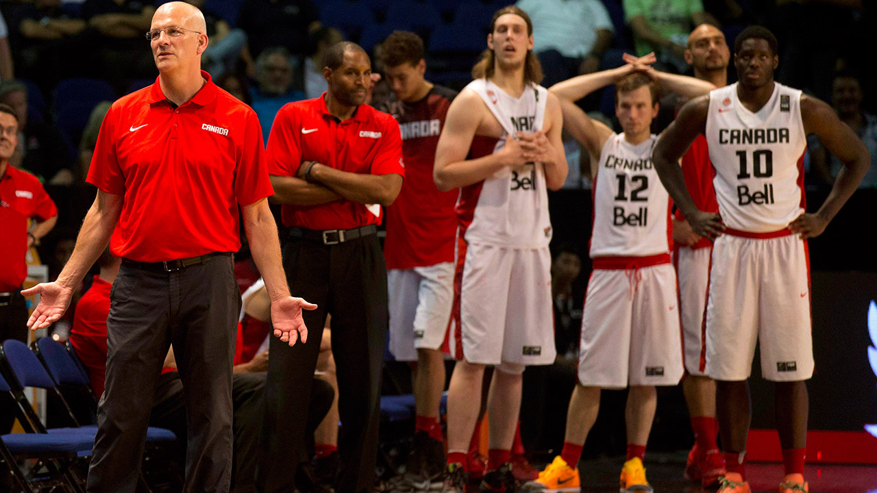 Jay Triano and the Canadian players react in the dying moments of Canada's loss to Venezuela. (Eduardo Verdugo/AP)
