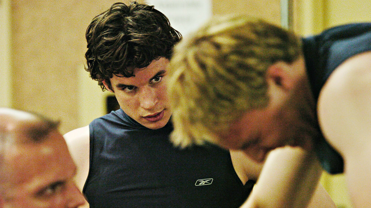 Sidney Crosby, centre, looks on as Jack Johnson, right, rides the stationary bike during the 2005 NHL Combine Entry Draft Testing in Toronto Saturday June 4, 2005. (CP PHOTO/Aaron Harris)