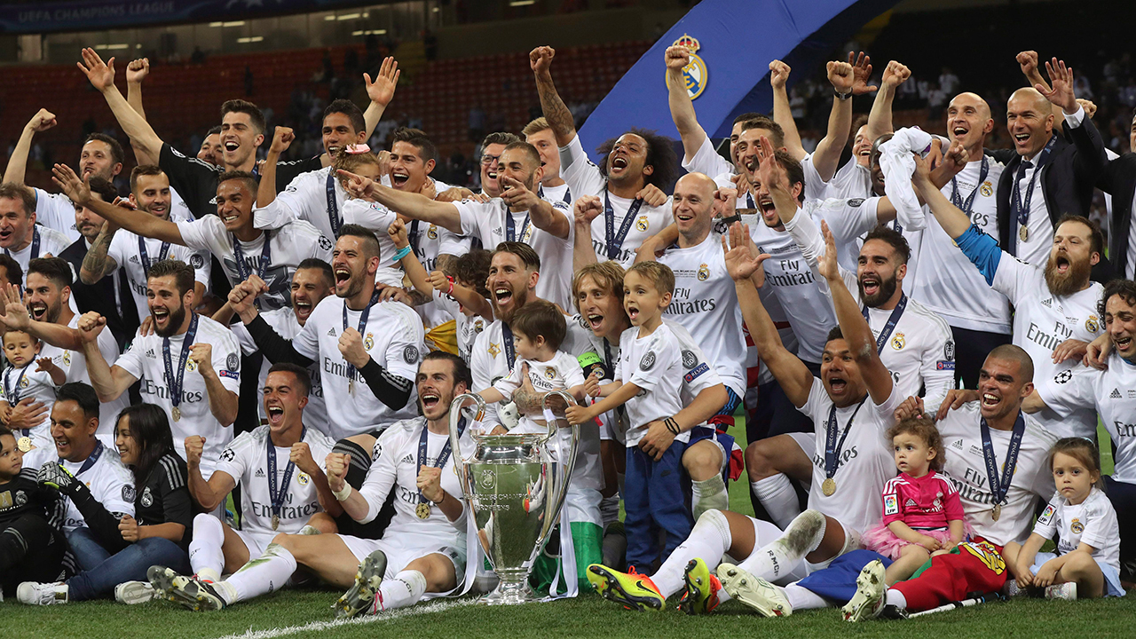 The team of Real Madrid pose with the trophy after the Champions League final against Atletico Madrid. (Luca Bruno/AP)