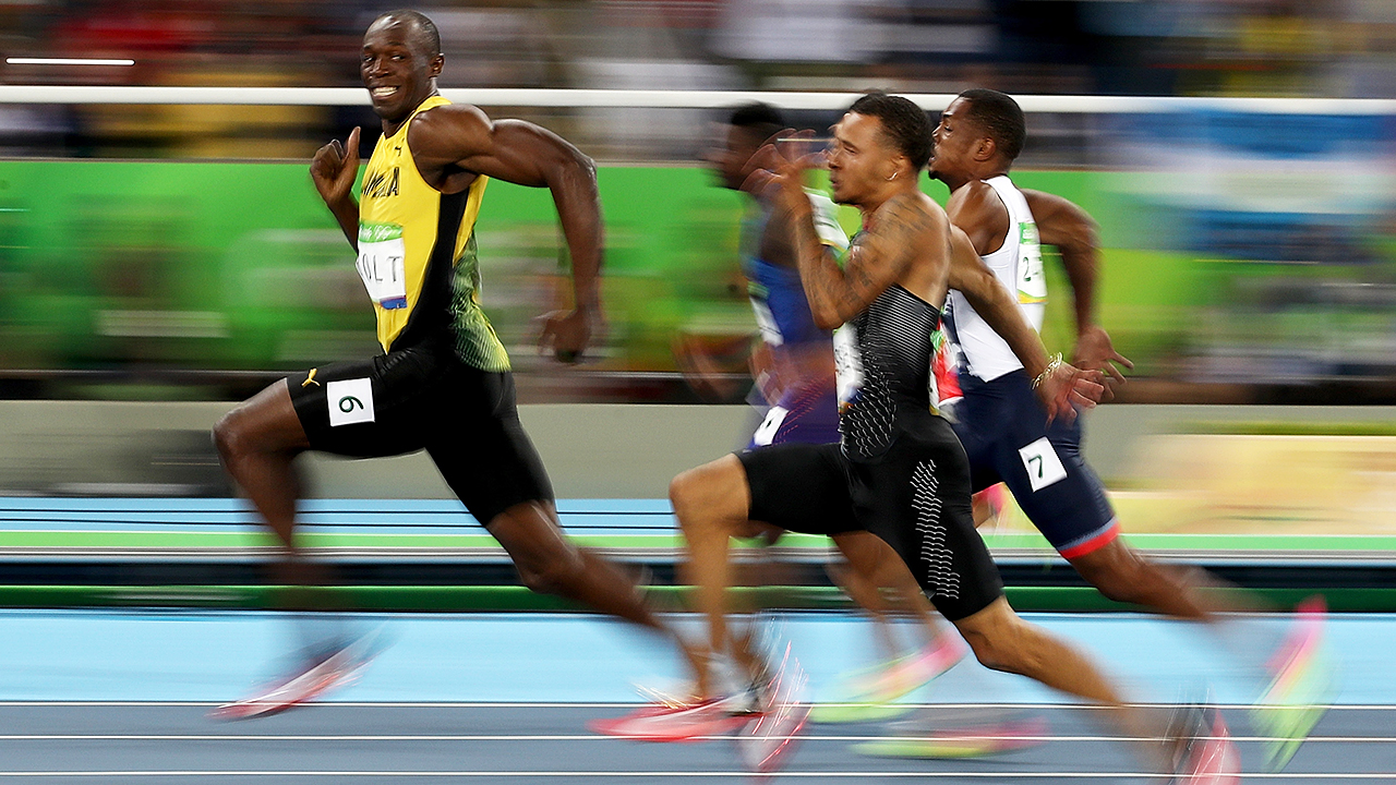THE photo of Rio 2016. Usain Bolt takes time out of the 100m semifinals to smile for a picture. (Cameron Spencer/Getty)