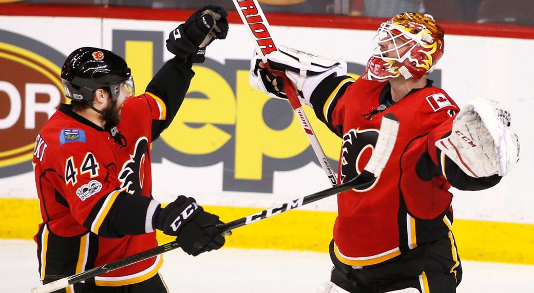 Flames beat Sharks 5-2 to clinch playoff berth Flames beat Sharks 5-2 to clinch playoff berth