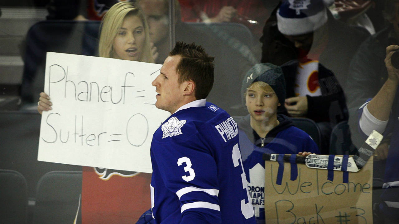 Dion Phaneuf skates past fans during a warmup ahead of his first game back in Calgary. 