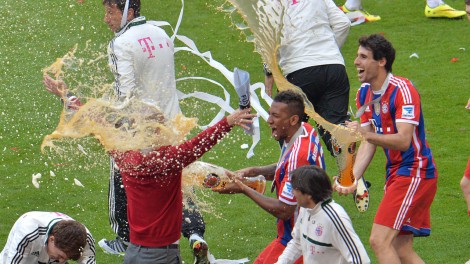 Guardiola gets his first of many beer showers. (AP)