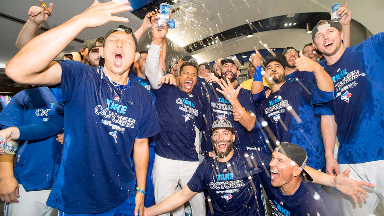 TORONTO, ON - SEPTEMBER 30: Toronto Blue Jays team mates celebrate