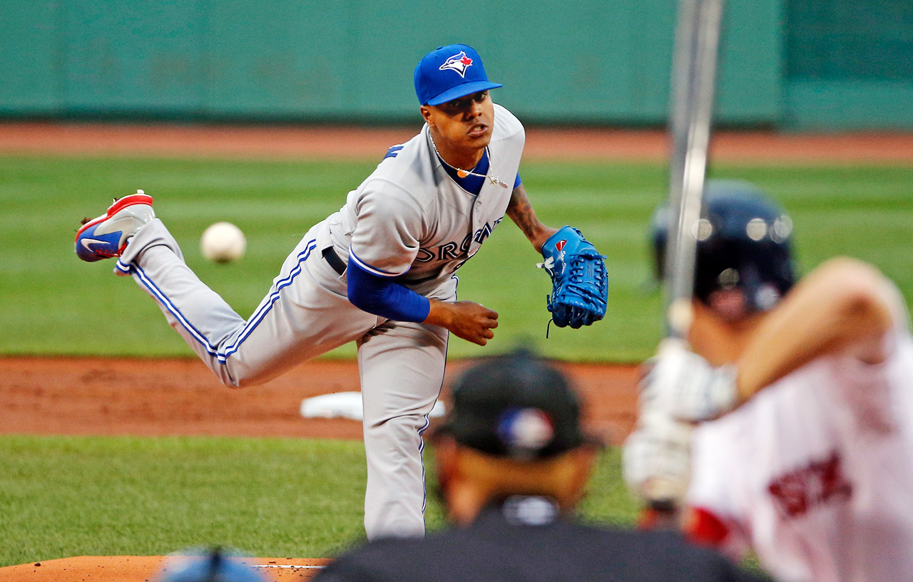 Marcus Stroman of the Toronto Blue Jays poses with his parents and