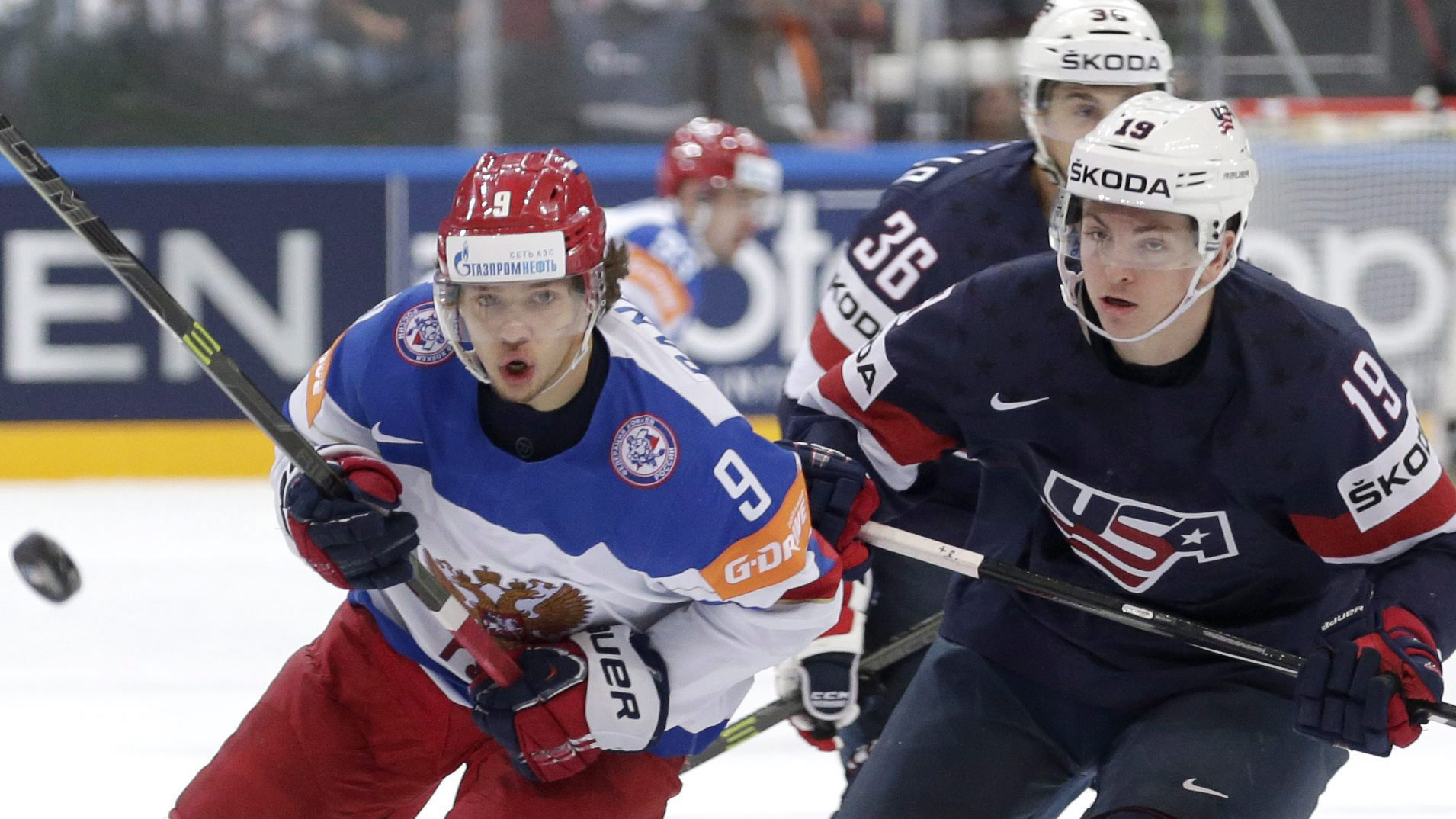 Russia’s Artemi Panarin, left, follows a puck with Jimmy Vesey, of the United States, right, during the Hockey World Championships semifinal match in Prague, Czech Republic. (Petr David Josek/AP) 
