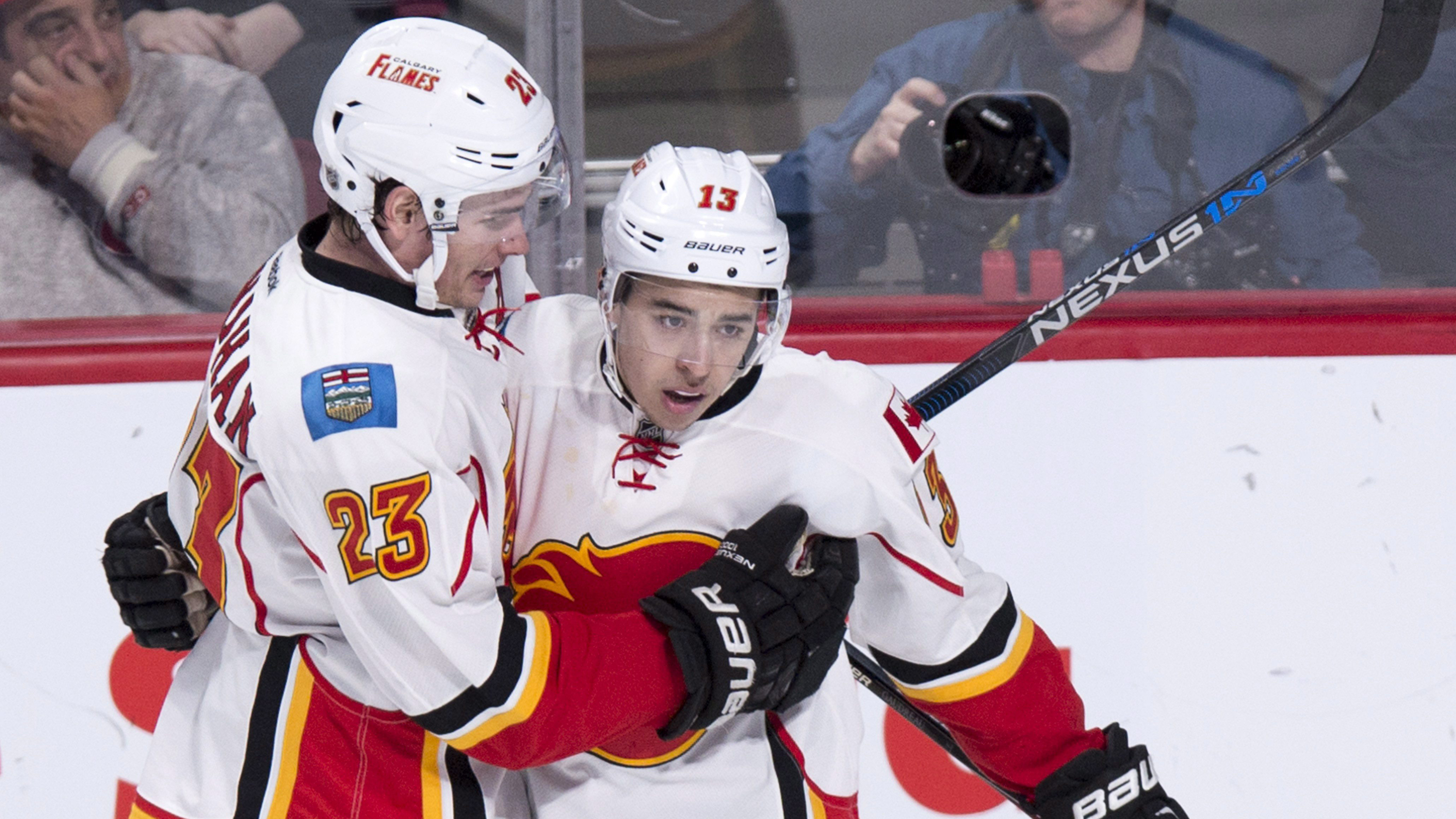Calgary Flames' Johnny Gaudreau, right, celebrates his goal against the Montreal Canadiens with teammate Sean Monahan. (Paul Chiasson/CP)