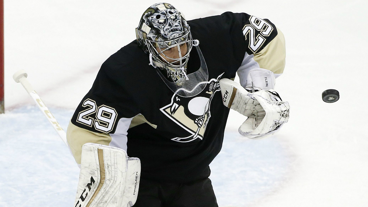 Pittsburgh Penguins goalie Marc-Andre Fleury (29) blocks a shot during the first period of an NHL hockey game against the Nashville Predators in Pittsburgh, Thursday, March 31, 2016. (AP Photo/Gene J. Puskar)