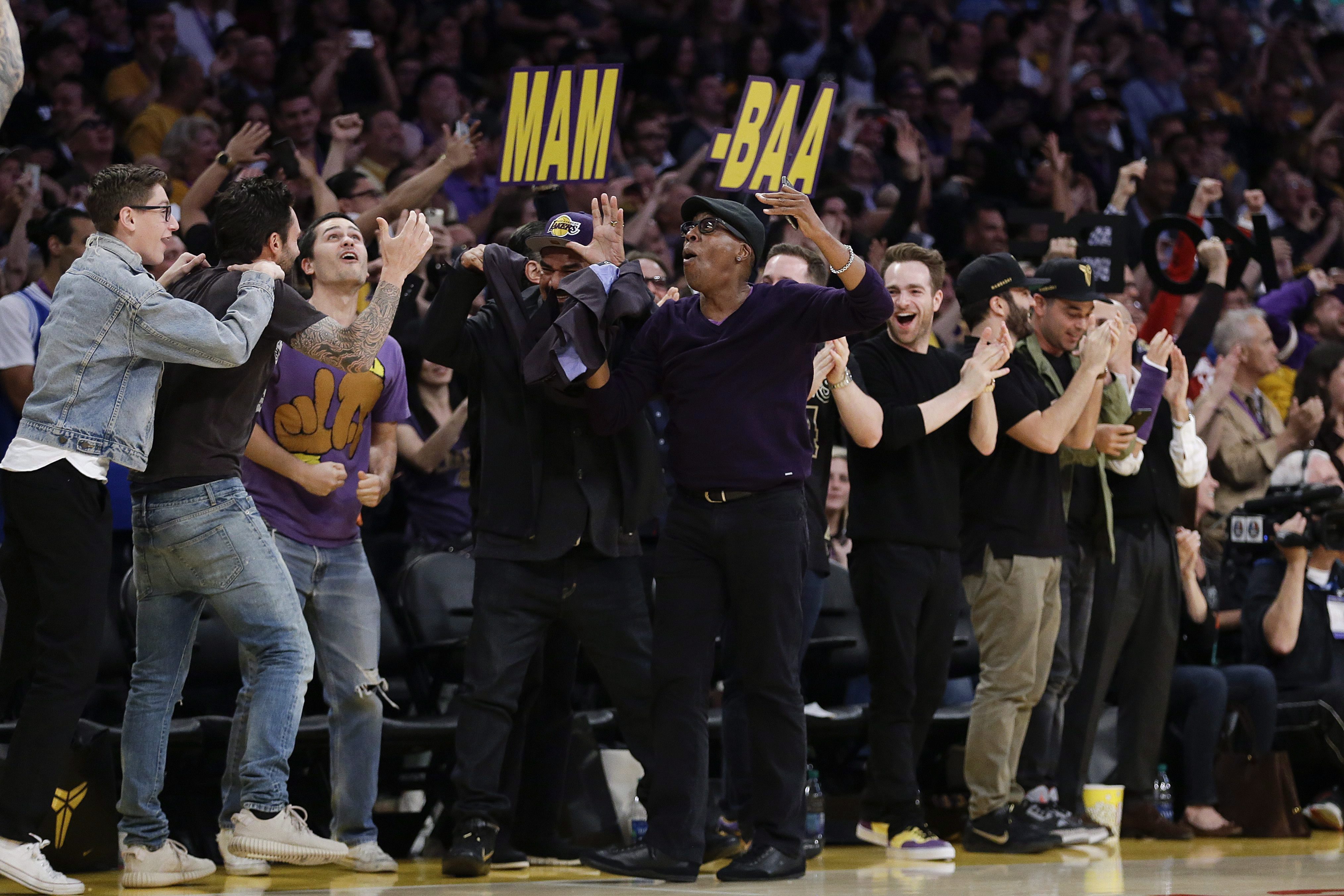 Comedians Arsenio Hall, center right, and George Lopez, center left, react to a basket made by <a href=