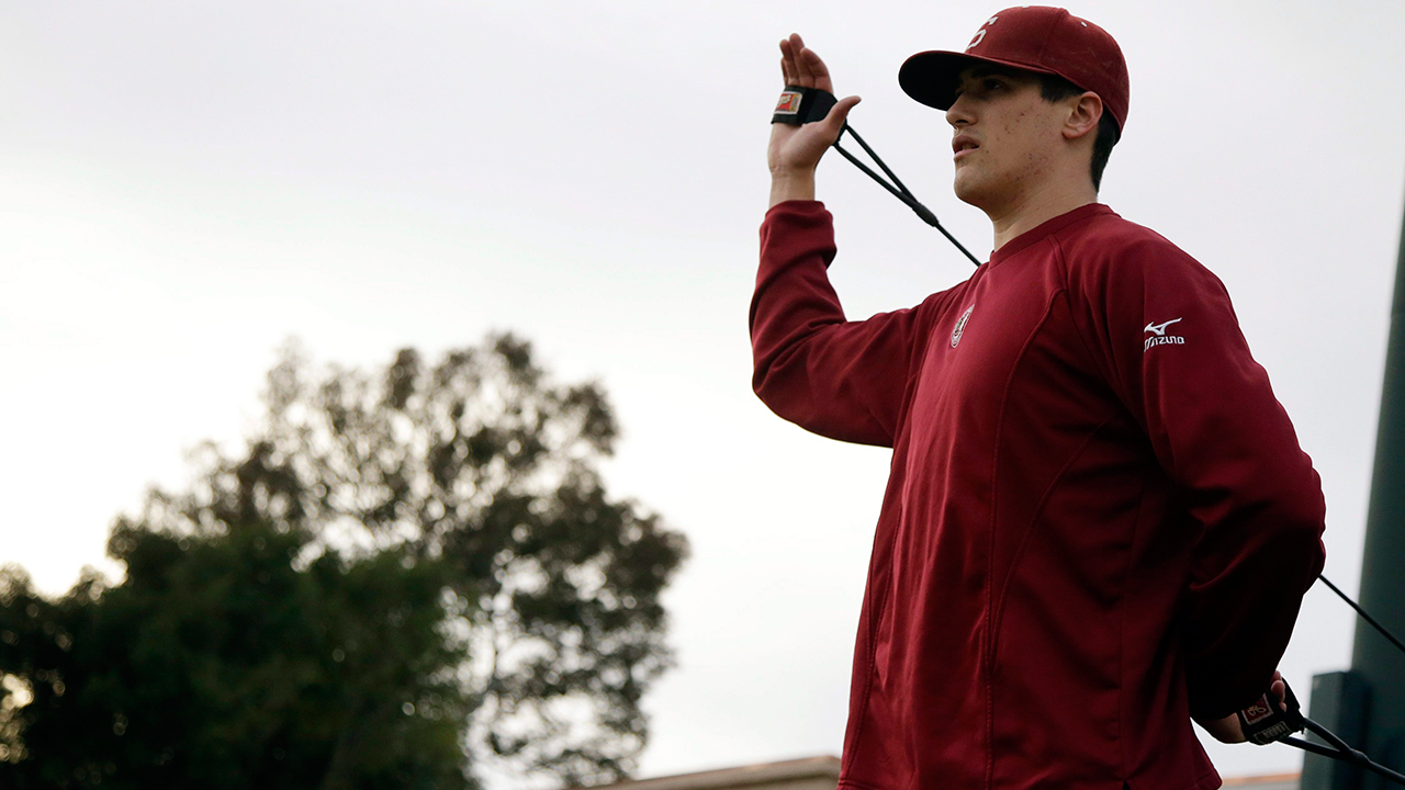 In this Thursday, Jan. 21, 2016, photo, Stanford pitcher Cal Quantrill stretches during a team workout, in Stanford, Calif. (Marcio Jose Sanchez/AP)