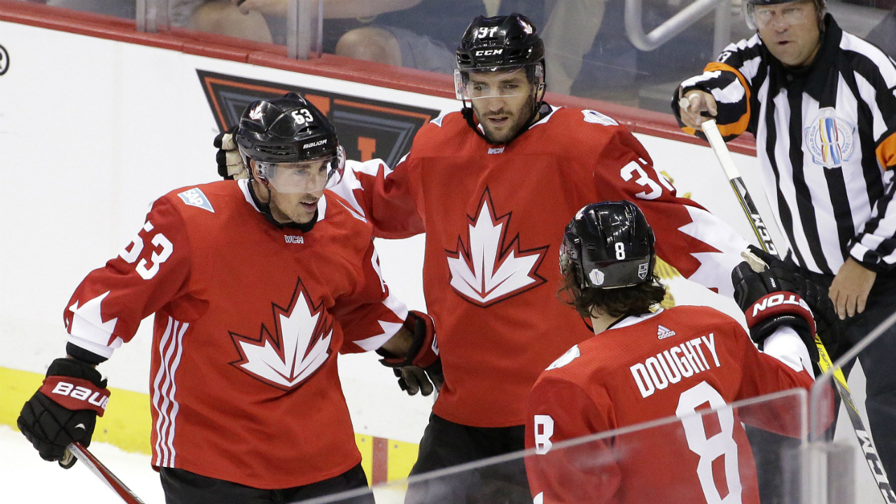 Team Canada's Patrice Bergeron (37) celebrates his goal with Brad Marchand (63) and Drew Doughty (8) during the first period of a World Cup of Hockey exhibition game against Team Russia in Pittsburgh on Wednesday, Sept. 14, 2016. (AP Photo/Gene J. Puskar)