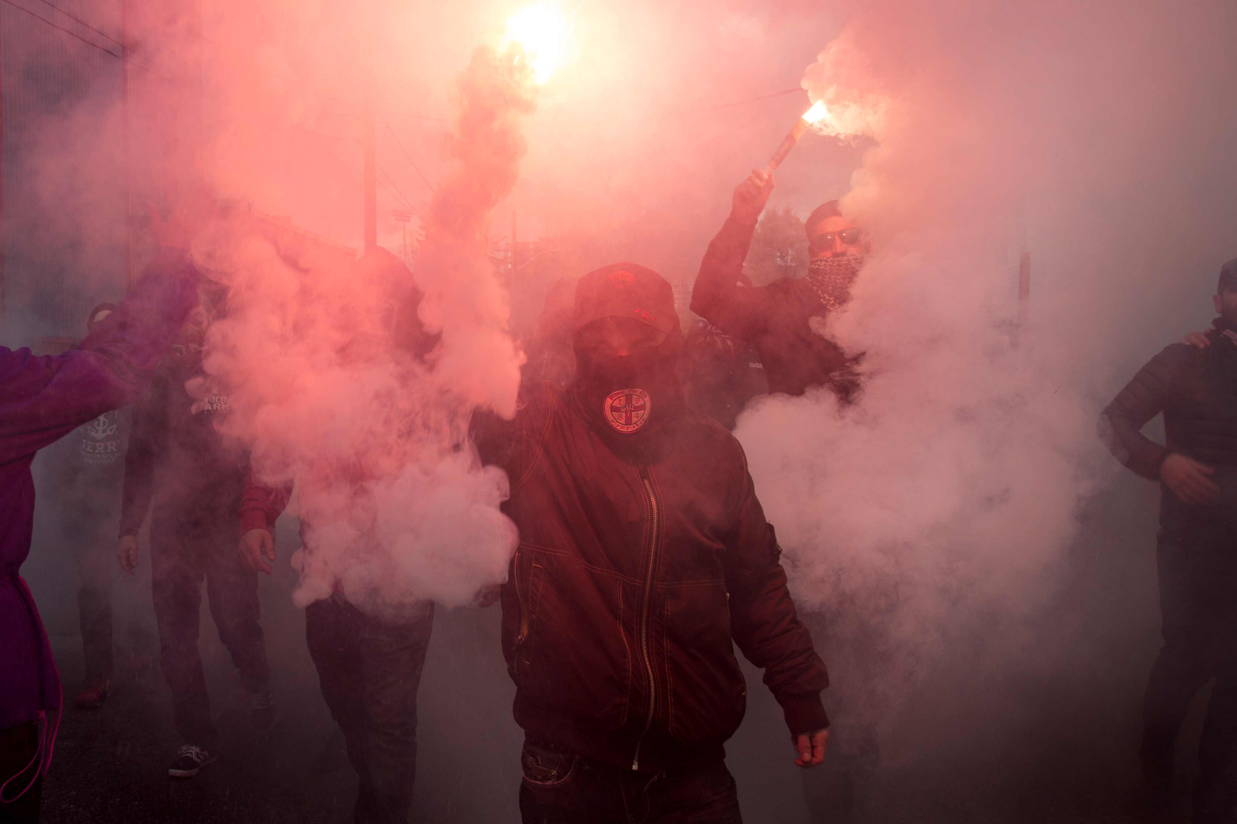 Members of the Inebriatti, a Toronto FC supporters group, light flares ahead of TFC's playoff matchup against the Philadelphia Union on October 26, 2016. (Maggie Naylor)