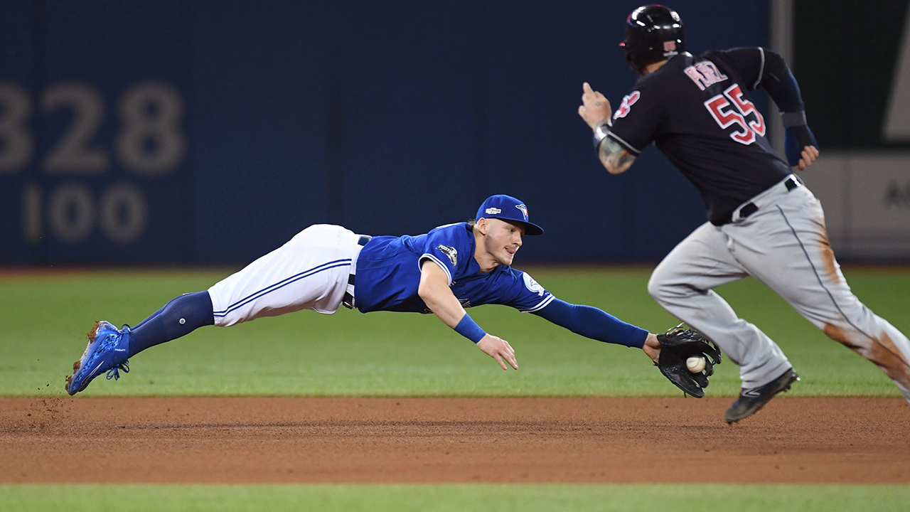 Josh Donaldson makes a diving catch on a ground ball out in front of Cleveland's Roberto Perez during fifth inning of Game 4 of the ALCS in Toronto on Tuesday, October 18, 2016. (Frank Gunn/CP)