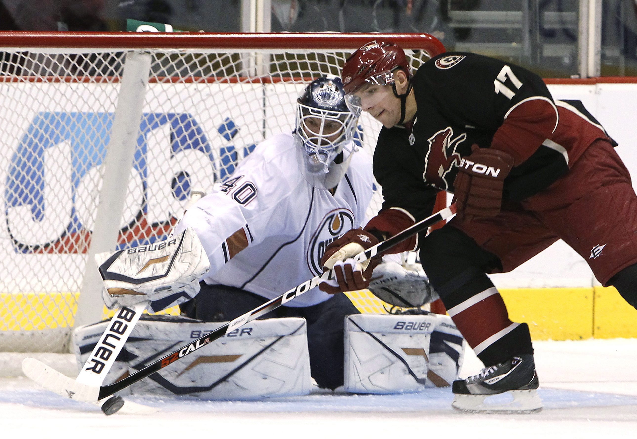 Edmonton Oilers' Devan Dubnyk (40) makes a save on a shot by Phoenix Coyotes' Radim Vrbata (17), of the Czech Republic, during the third period of an NHL hockey game Tuesday, Jan. 25, 2011, in Glendale, Ariz. The Oilers defeated the Coyotes 4-3. (AP Photo/Ross D. Franklin)