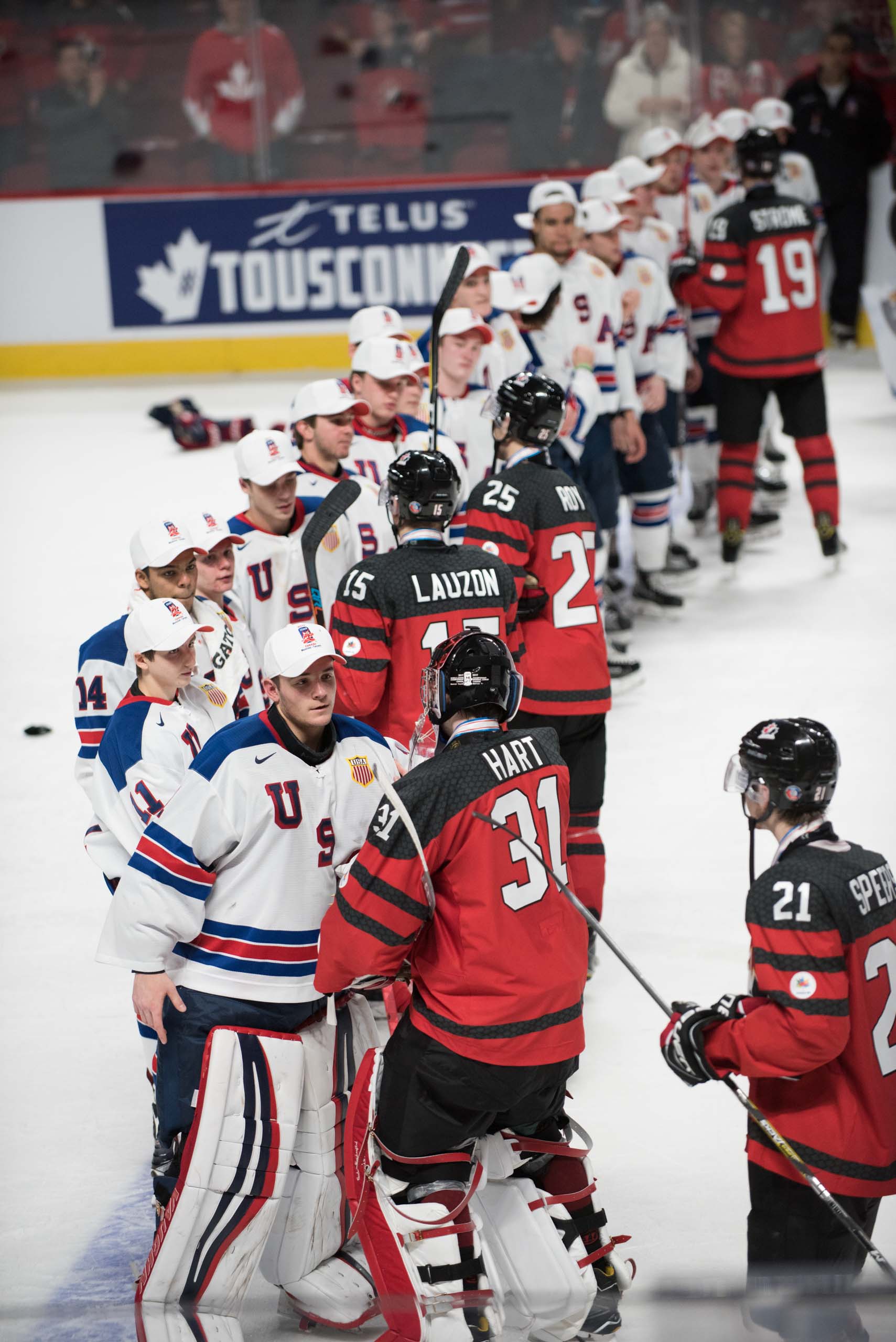 And at the conclusion of this hard-fought battle, the game ends the same way all championship hockey games do: with a handshake line between opponents. (Photo by Julien Grimard) 
