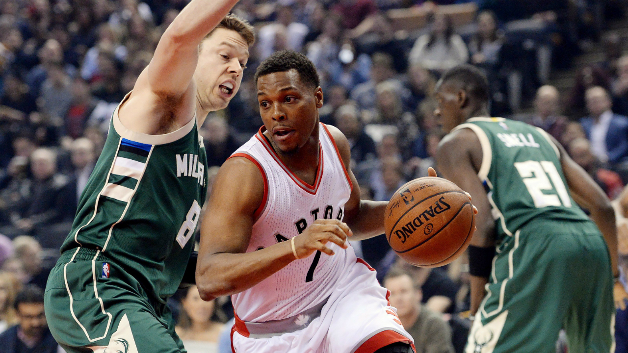 Milwaukee Bucks guard Matthew Dellavedova (8) guards Toronto Raptors guard Kyle Lowry (7) as he drives to the net during first half NBA basketball action in Toronto on Friday, January 27, 2017. (Nathan Denette/CP)