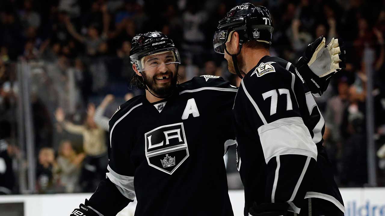 Los Angeles Kings defenceman Drew Doughty, left, congratulates centre Jeff Carter (77) for scoring the winning goal against Nashville Predators during the overtime period of an NHL hockey game in Los Angeles, Thursday, Oct. 27, 2016. The Kings won 3-2, in overtime. (Alex Gallardo/AP)