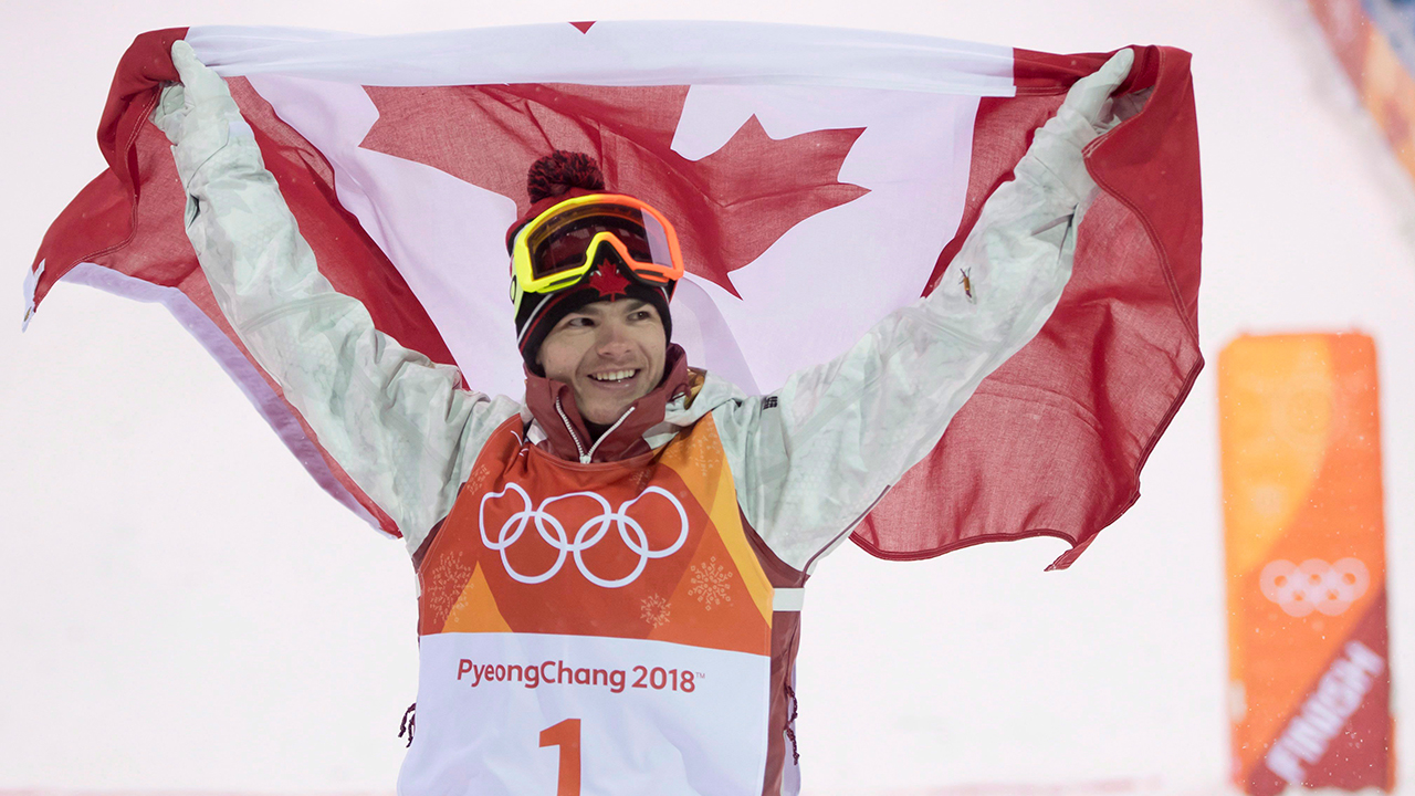 Canadian Mikael Kingsbury celebrates winning his gold medal in the moguls finals at the Pyeongchang 2018 Winter Olympic Games