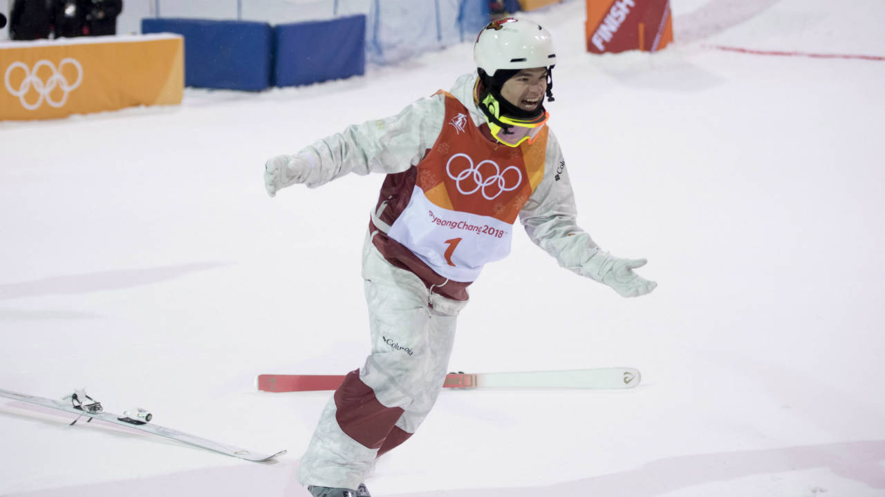 Canadian Mikael Kingsbury celebrates after winning the gold medal in the moguls finals at the Phoenix Snow Park at the Pyeongchang 2018 Winter Olympic Games in South Korea, Monday, Feb. 12, 2018. (Jonathan Hayward/CP)