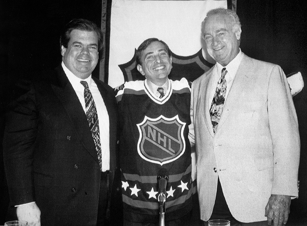 Bruce McNall poses with Gary Bettman and Gil Stein during the press conference to announce Bettman as newly minted commissioner of the NHL.