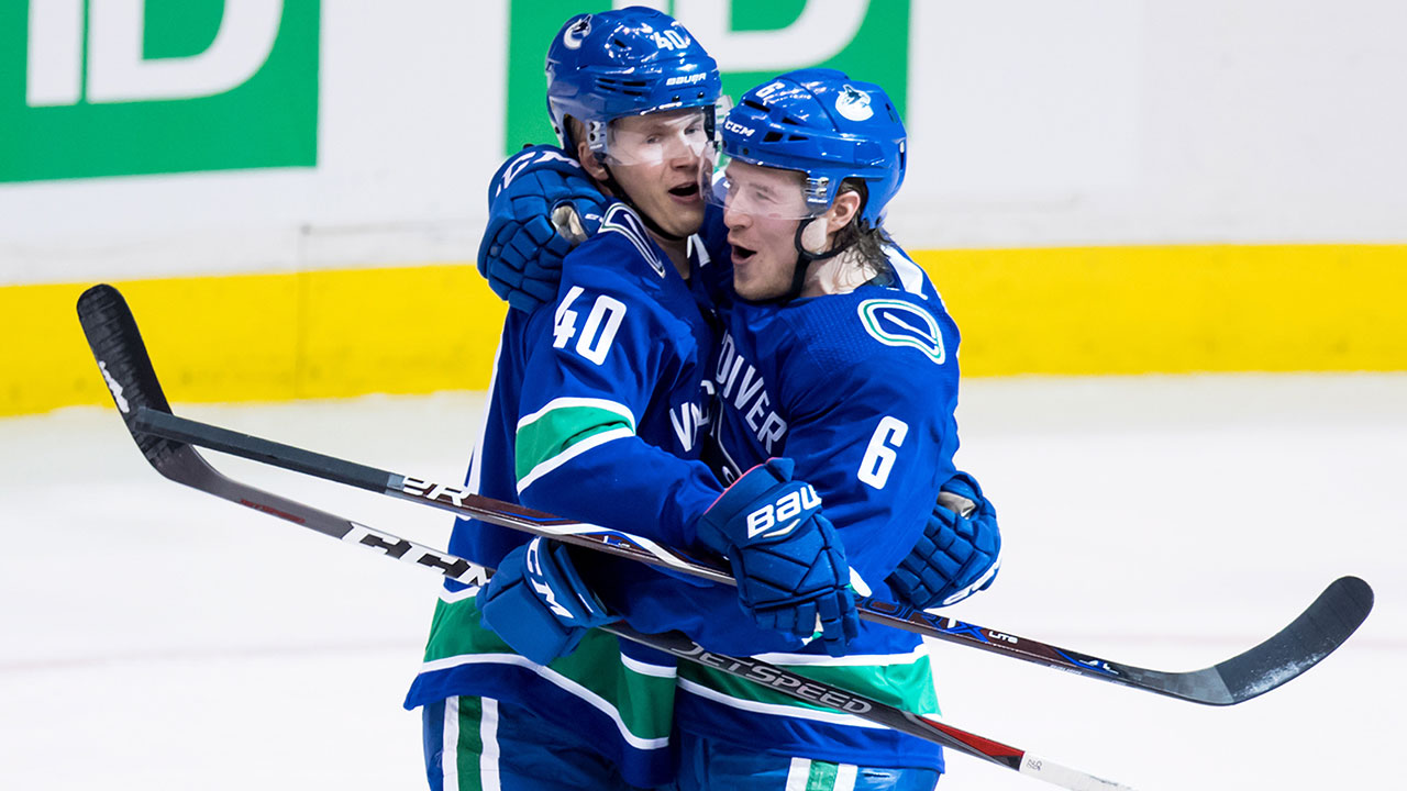 elias-pettersson-celebrates-with-brock-boeser