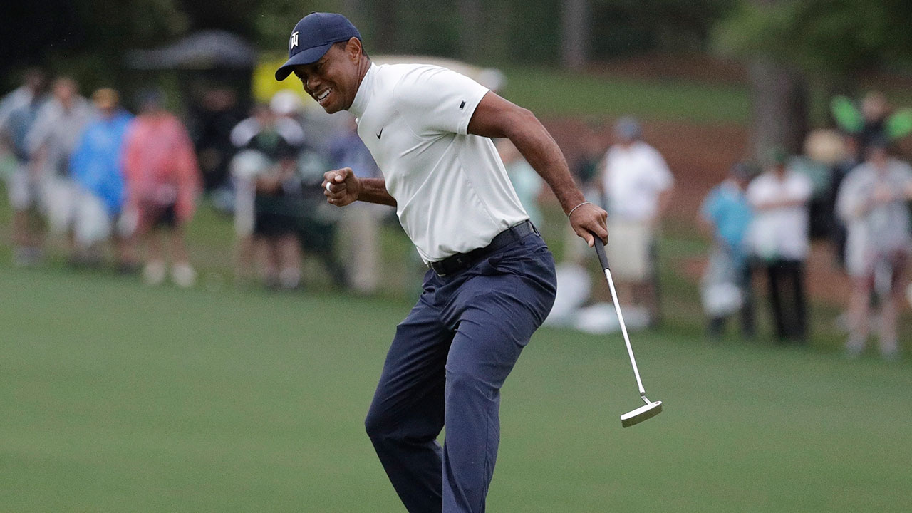 Golf-PGA-Woods-celebrates-putt-at-Masters